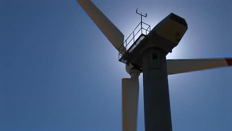 closeup of the rotor nacelle and tower of a wind turbine at tehachapi california