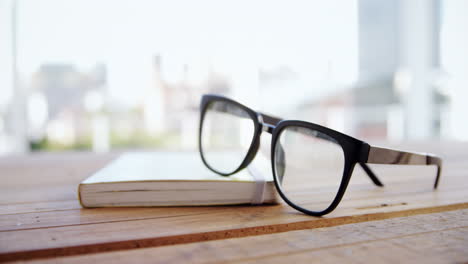 close-up of spectacles on book 4k