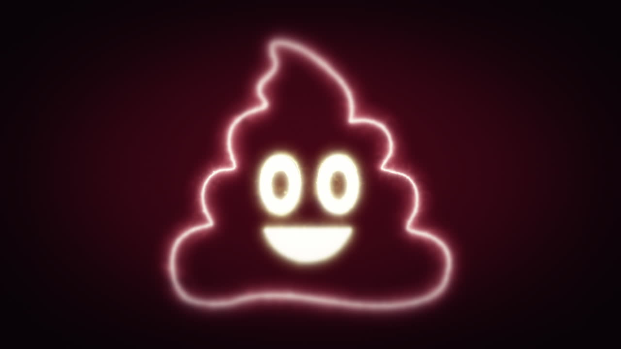 A cute smiling laughing poop face , an ironic symbol for online communications, appearing from the darkness over a red-brown background