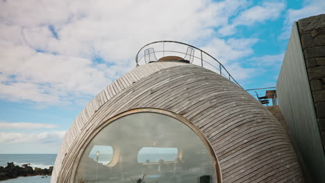 wide shot from the exterior of futuristic dome-like restaurant