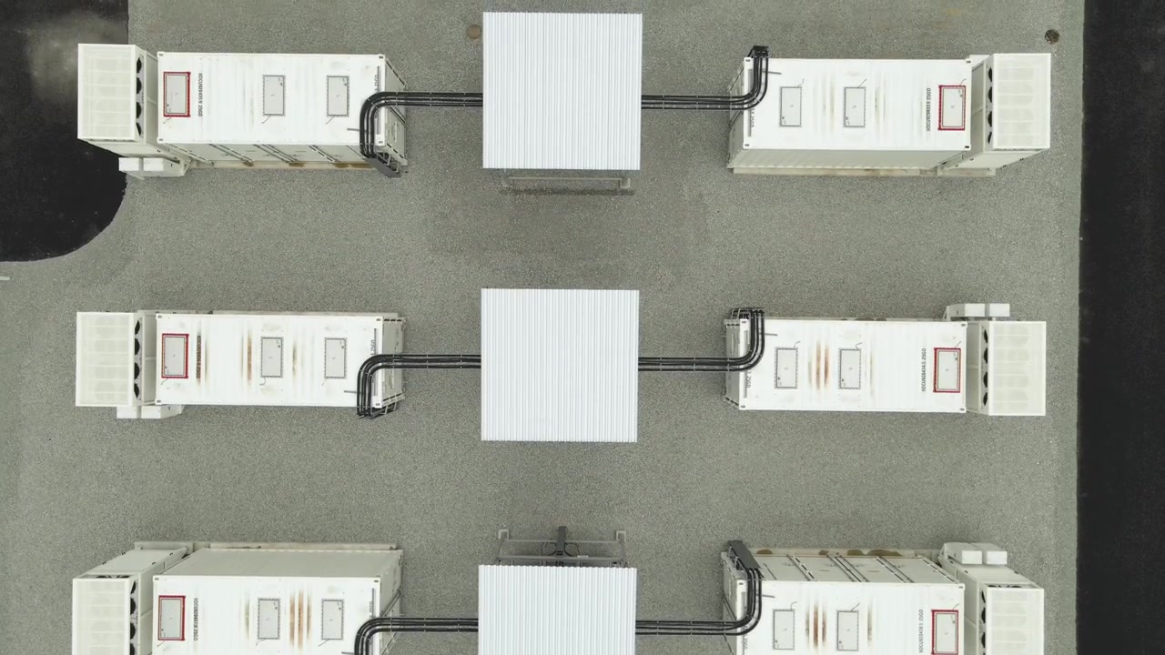 Top down aerial view of a BESS, a battery energy storage system. These containers hold large scale li ion batteries for green power