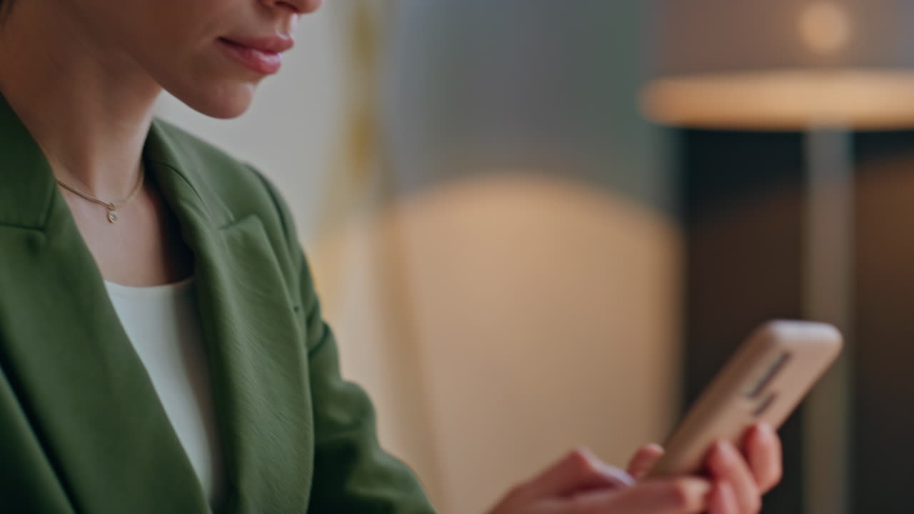 Calm lady face watching telephone typing screen office closeup. Woman messaging