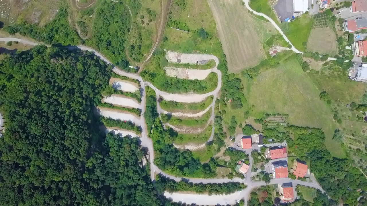 Medieval Old Town Atop Of Mount Titano With Lush Vegetation In San Marino, Southern Europe. - Aerial Topdown