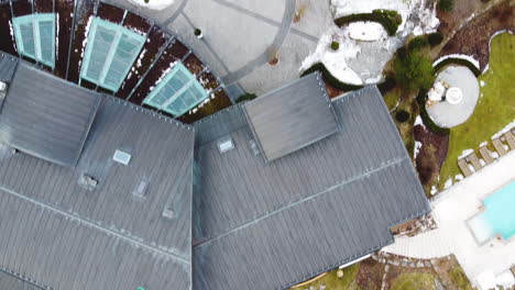 Aerial-footage-of-the-Alpen-Palace-hotel-and-grounds-in-winter