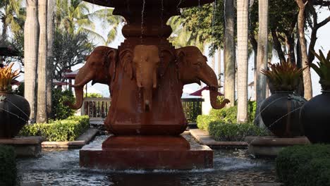 water flowing from a rustic elephant fountain