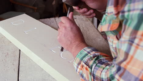 Stone-Mason-At-Work-On-Carving-In-Studio-Shot-On-RED-Camera