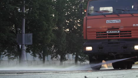 street cleaning truck washing the road