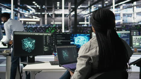 data center admin uses ai technology on laptop for machine learning workloads