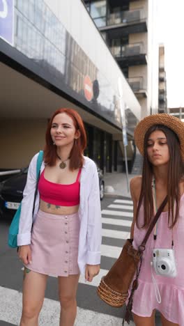 two young women walking in the city