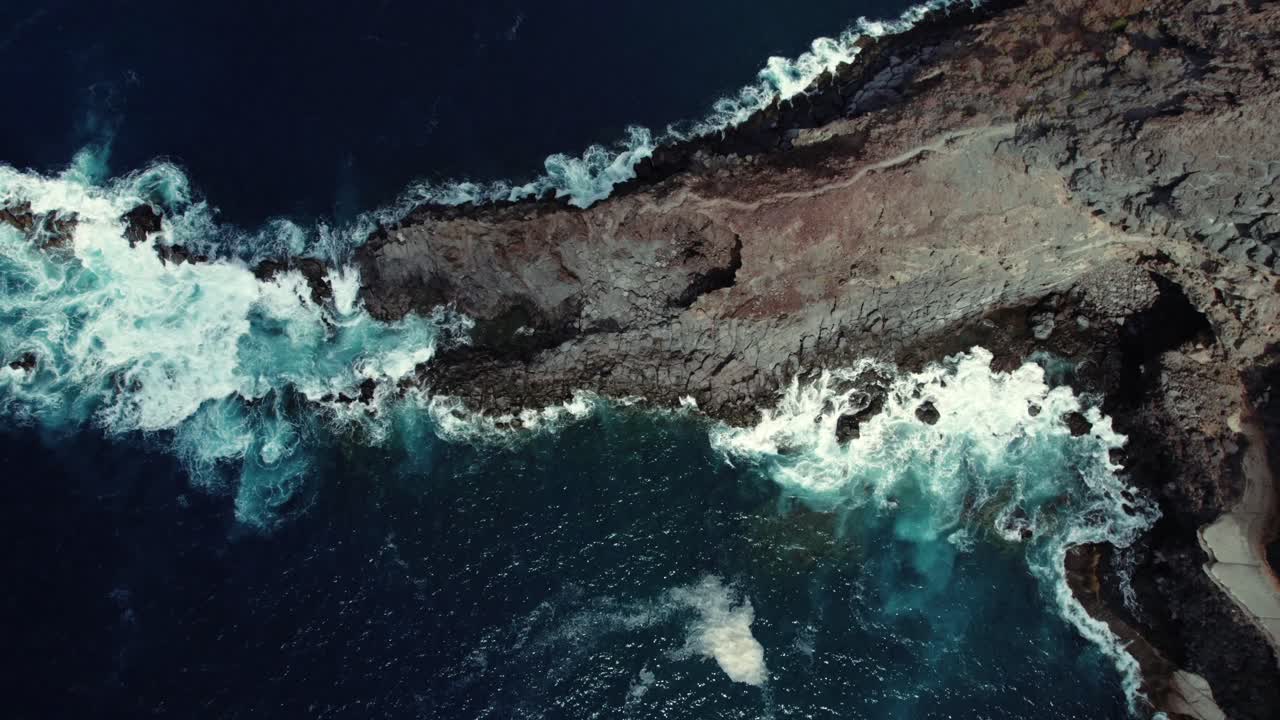 Drone ocean swell along Canary Islands volcanic cliffs