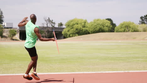 Sportsman-doing-javelin-throw