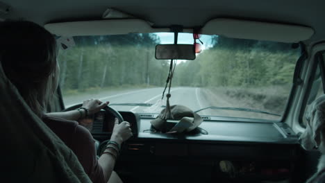 Woman-Traveling-in-Van-with-Dog