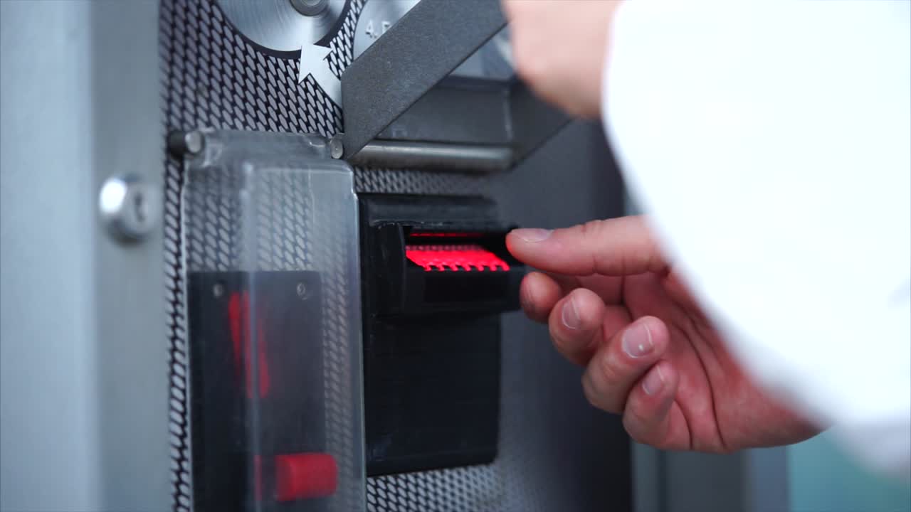 Person using a Card Reader Machine