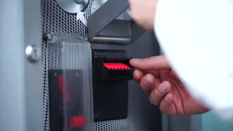 Person using a Card Reader Machine