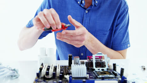 computer engineer repairing computer motherboard