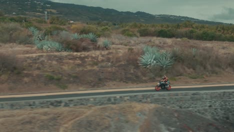4k aerial motocycle on coastal road