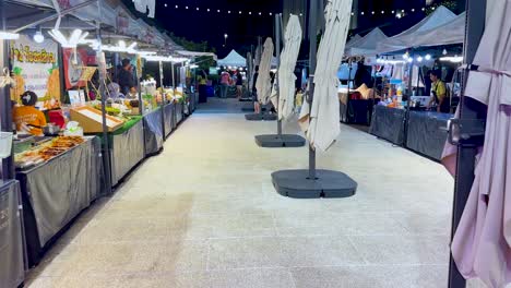 vibrant night market with food stalls and lights