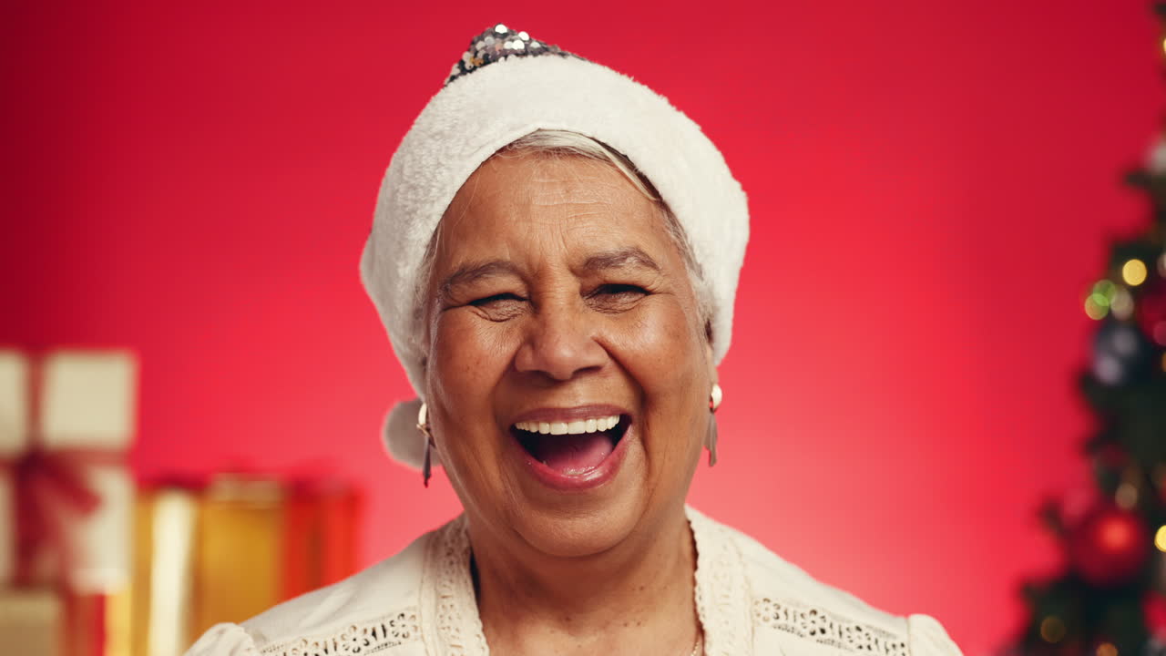 Festive Senior Woman Laughing in Santa Hat