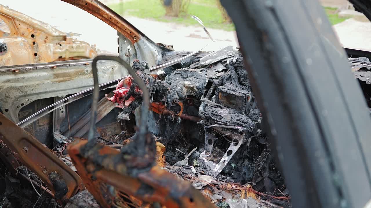 Burnt Car Cabin Represents Destruction Of Civilian Infrastructure In War