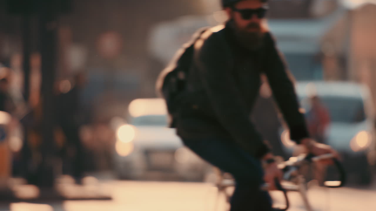 Anonymous crowd of people walking cycling bicycles commuters London City street slow motion