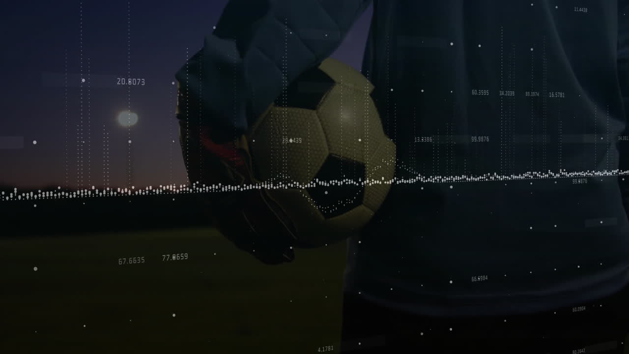 Soccer player holding ball with data processing animation over dark field