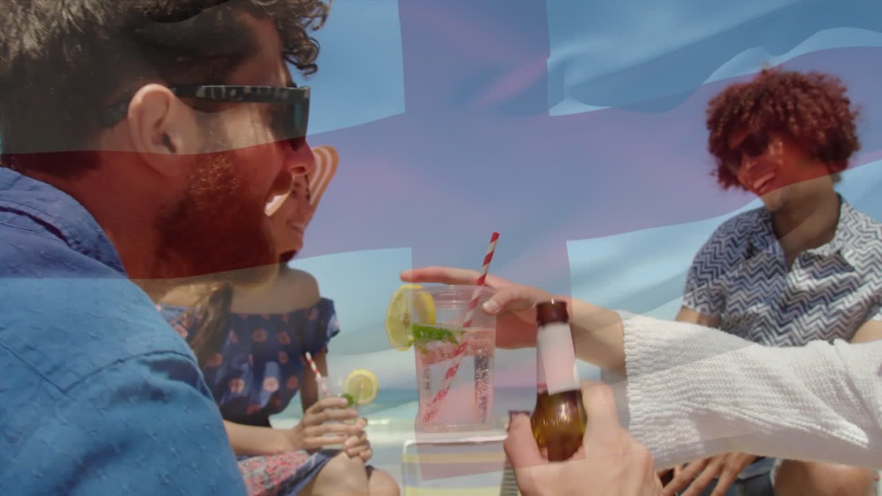 анимация размахивания английским флагом над группой друзей, развлекающихся на пляже