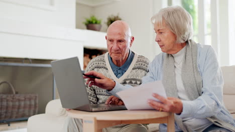 talking, elderly couple with financial document