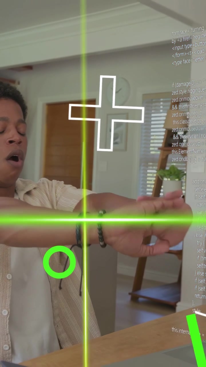 Vertical video: Man typing laptop, HUD line cutting face, making man stretch and check watch for IT