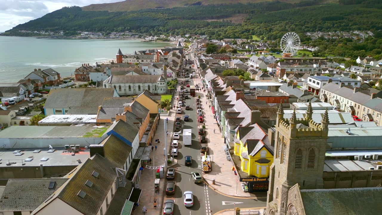 Slow travelling aerial video of Main Street in Newcastle, County Down, Northern Ireland. Produced in 4K, 60FPS and with Rec709 color.