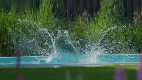 girl jumping in swimming pool