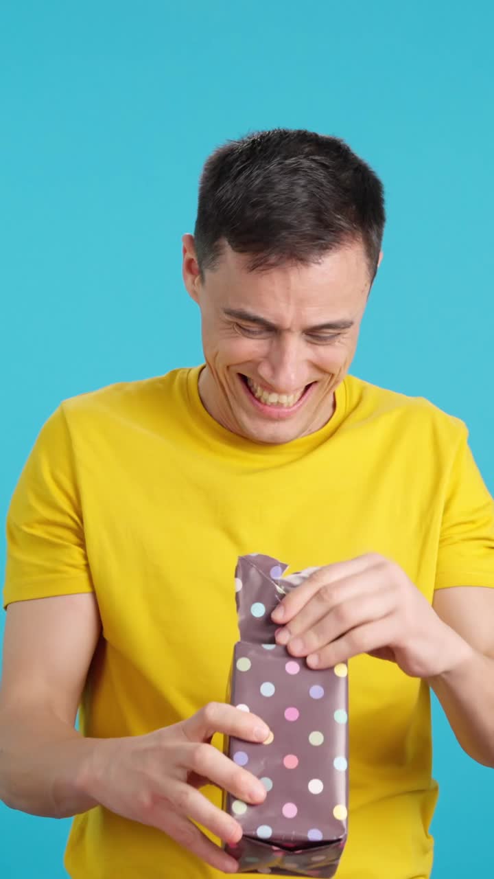 Man unwrapping a gift
