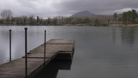 italy, lake in a rainy day shot of pier