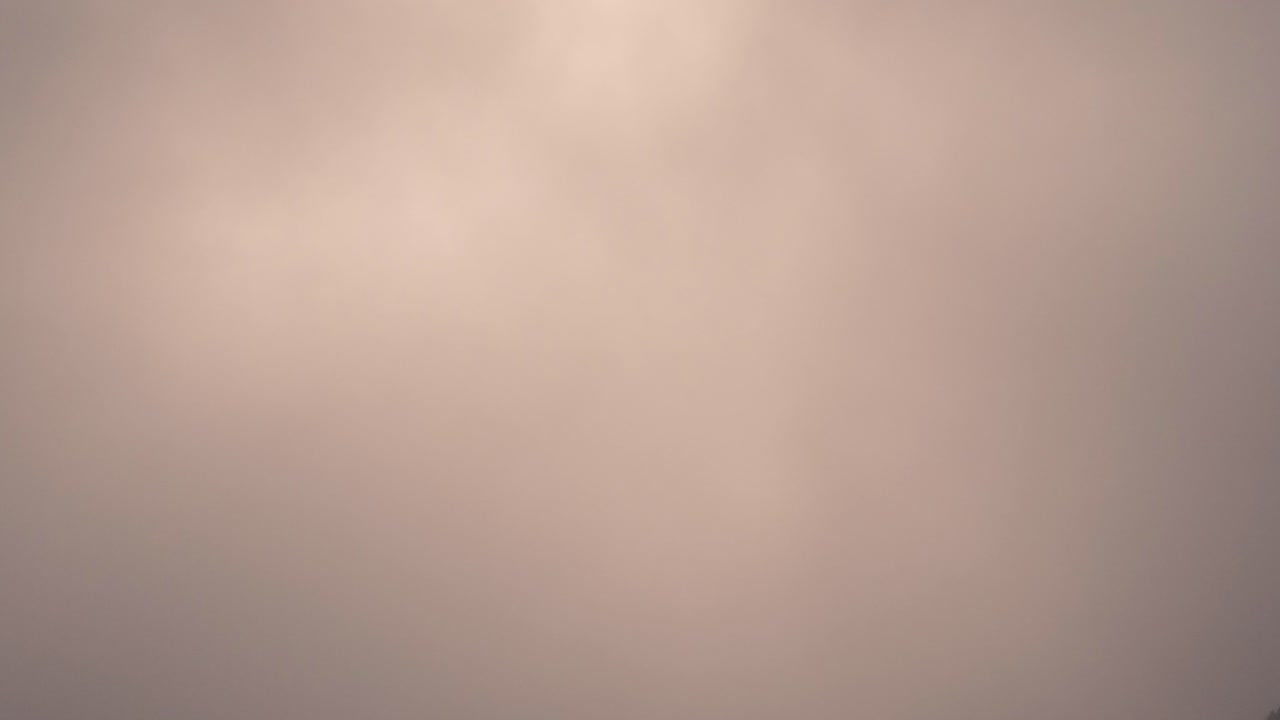 Dramatic timelapse of a cloudy valley in Gran Canaria at sunset. Warm golden light breaks through the mist, creating a breathtaking and cinematic scene. Perfect for nature, travel, and landscape