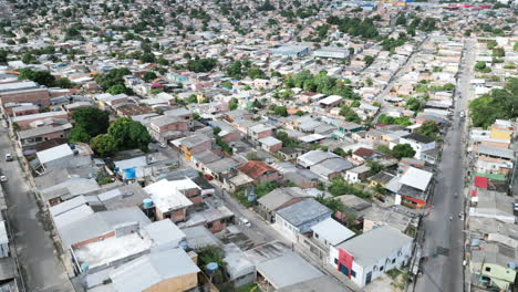 Aerial-flyover-of-the-neighborhoods-of-Manaus,-Brazil-with-traffic-and-roads-during-the-day