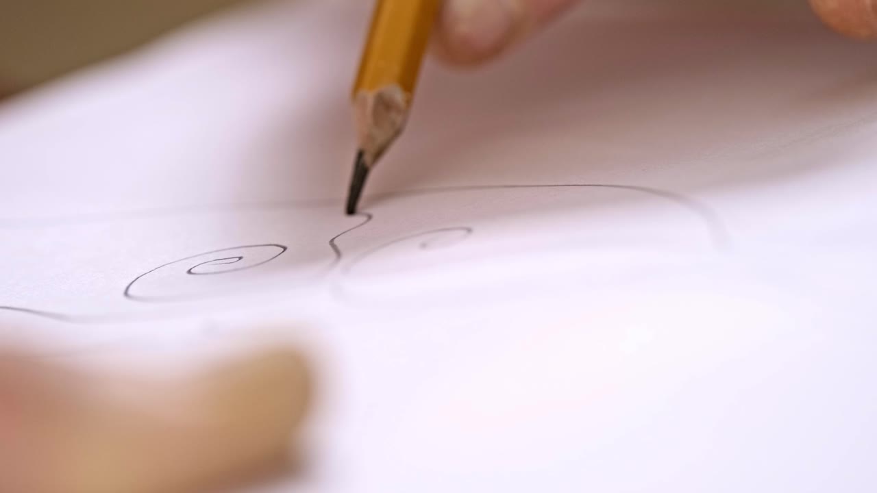 An Artistic Journey: Capturing the Intricacies of Pencil Sketching with Spirals on Paper Through Two Frames of Creative Expression