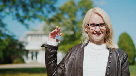 Proud--Woman-Holds-New-House-Key