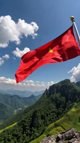 vietnamese flag over mountainous rice terraces