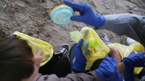 volunteers cleaning up beach litter