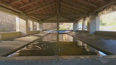 interior of old italian lavoir also called wash-house or public basin or lavatoio