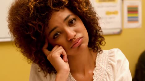 bored student looking at the camera in class