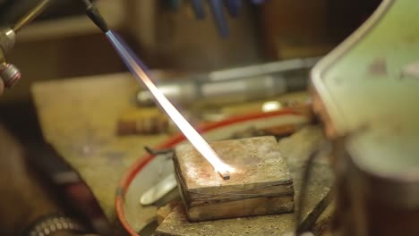 italian goldsmith at work building an engagement or a wedding ring