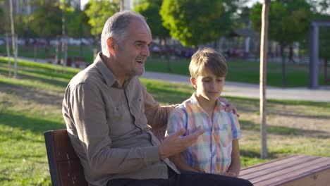 Grandfather-is-chatting-with-grandchild.