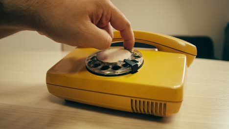 retro vintage phone, a yellow rotary telephone is displayed on a wooden desk, adding a nostalgic touch