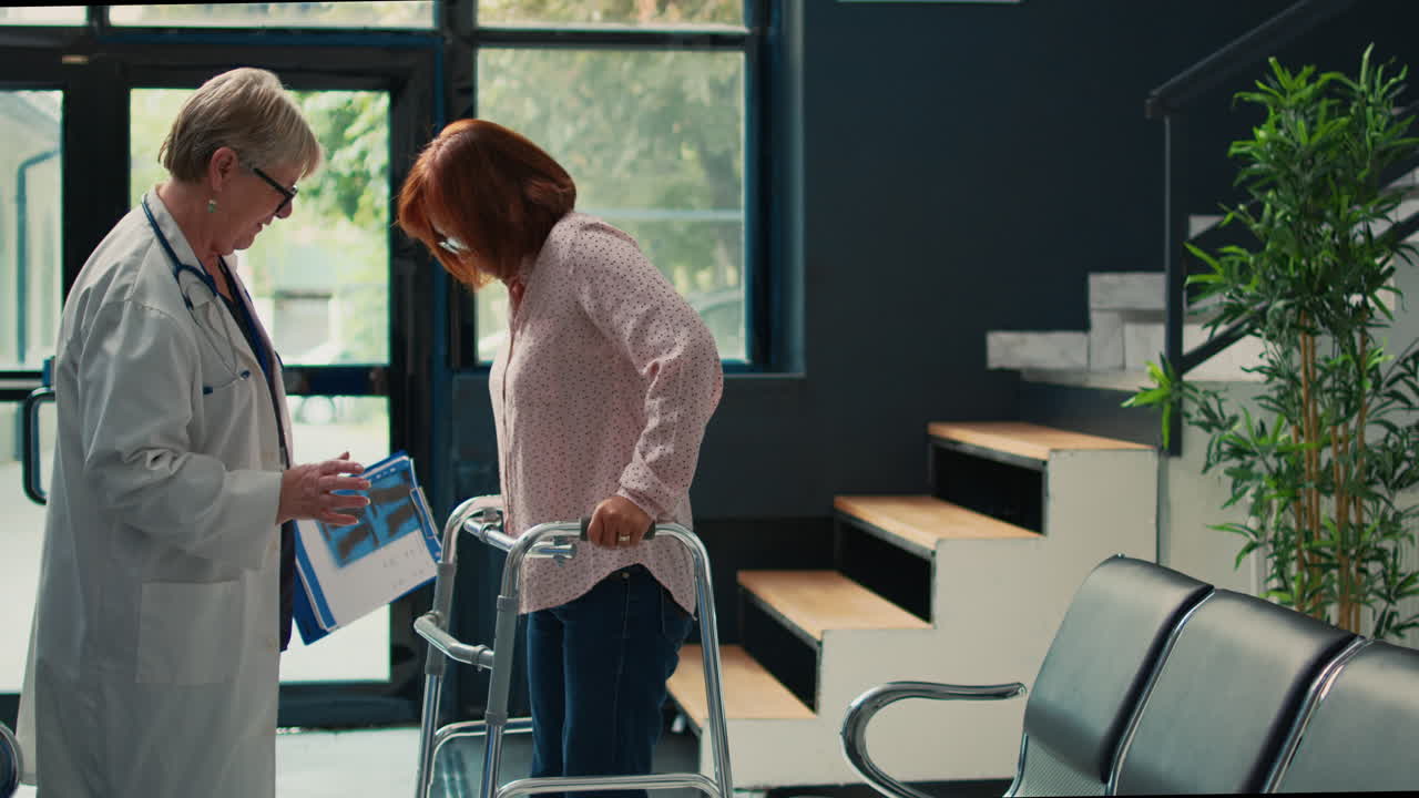 Doctor Assisting Patient with Walker