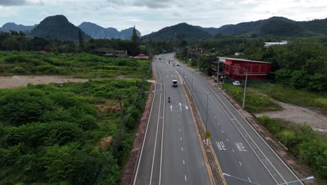 main road through thailand towards extreme mountainous landscape