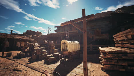 historic western town with wooden structures and covered wagon under blue sky