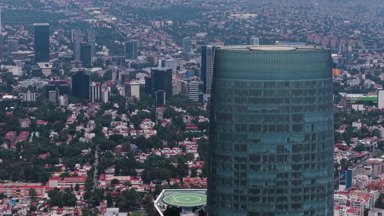 Parallax effect drone view, facing Mexico City's tallest skyscraper