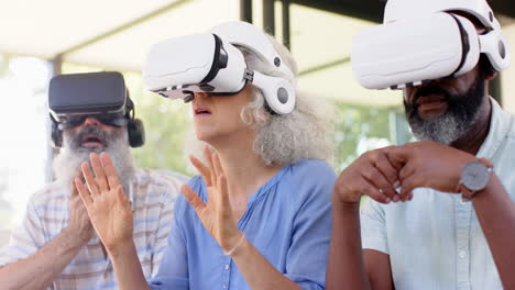 Using VR headsets, senior friends exploring virtual reality experience together