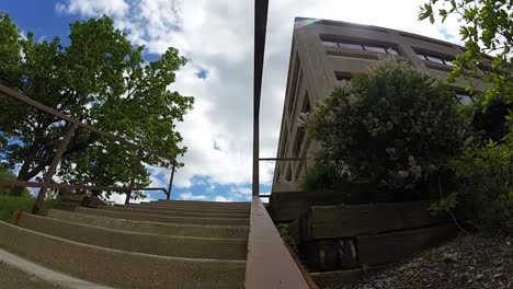 skateboard ollie down a big stair set