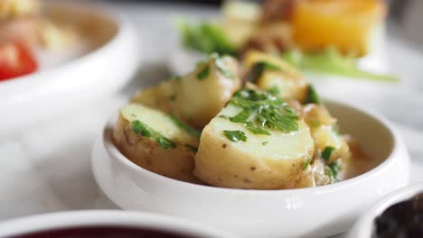 closeup of a plate of potatoes with parsley